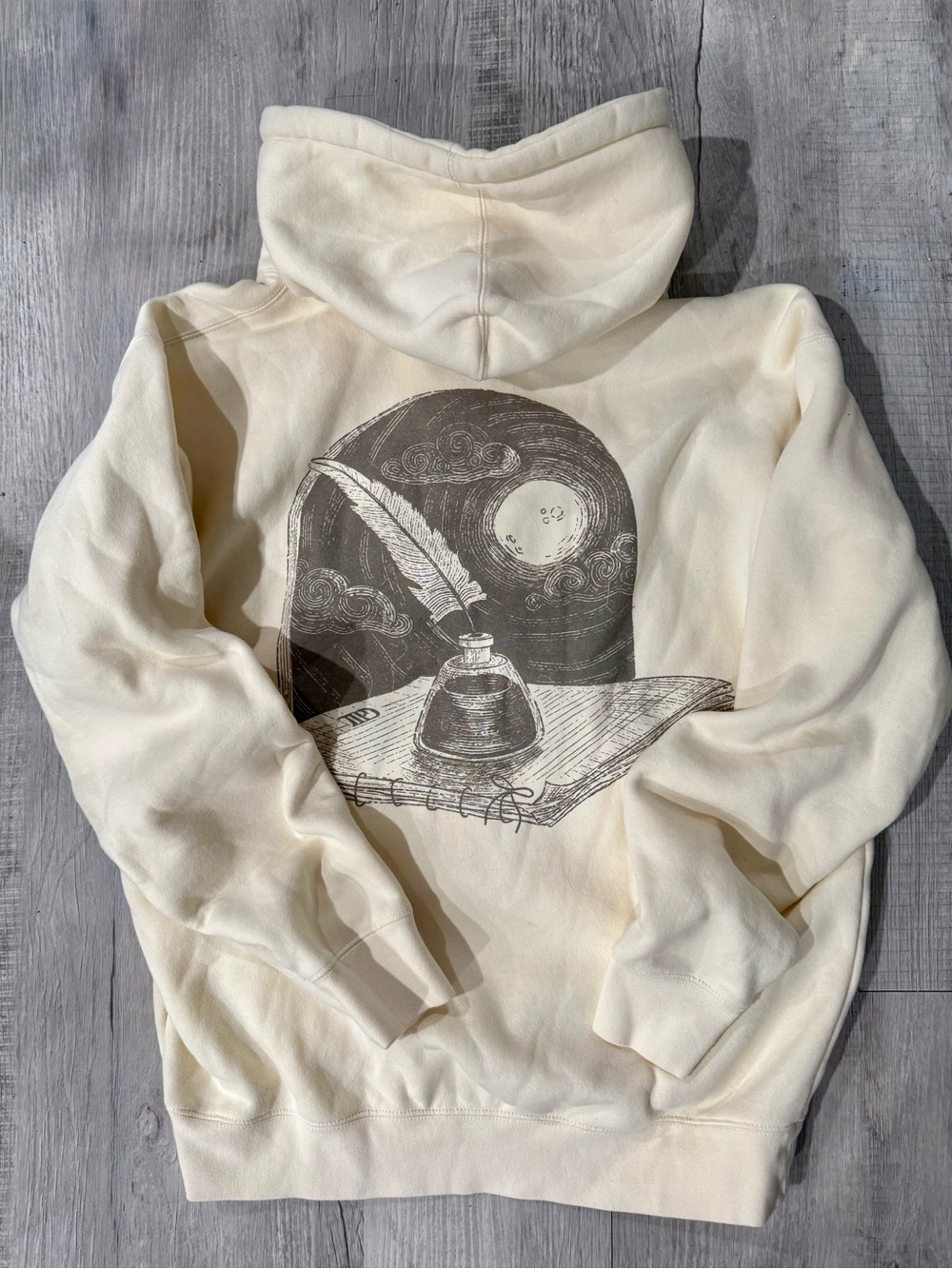 Taylor Swift Cream Hoodie with Minimal Dark Logo
